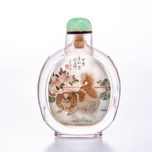 Crystal inside painted snuffbottle of a dog