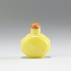 Pale lemon-yellow colour of faceted octagonal shape