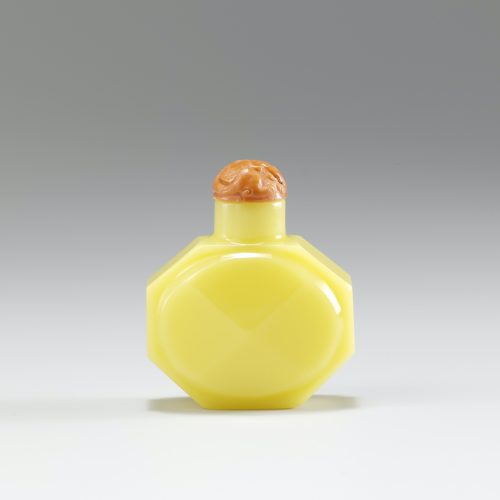 Pale lemon-yellow colour of faceted octagonal shape