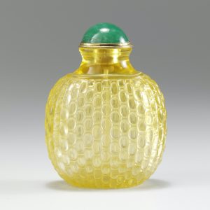 Bright yellow glass with wickerwork pattern