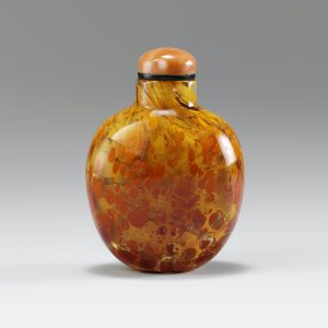 Orange glass of ovoid form