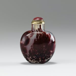 Deep crimson and maroon glass of ovoid form