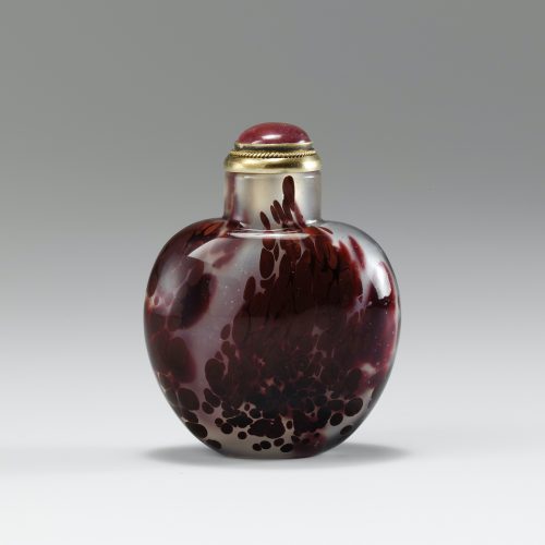 Deep crimson and maroon glass of ovoid form