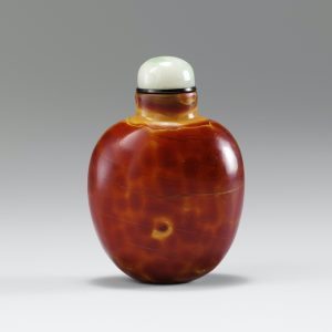 Deep red glass suffused with yellow dapples