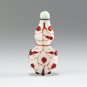 White glass with red overlay of double gourd form