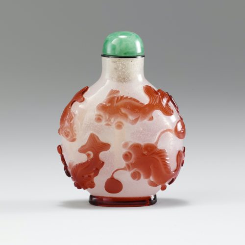 Glass with red overlay of four fan tailed carp