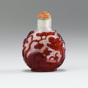 Translucent glass with red overlay with phoenix and fo dogs