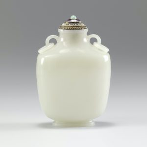 Nephrite of flask form with mask and ring handles