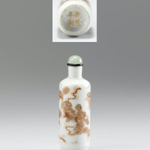 Porcelain enamelled in iron red with a group of Buddhist lions