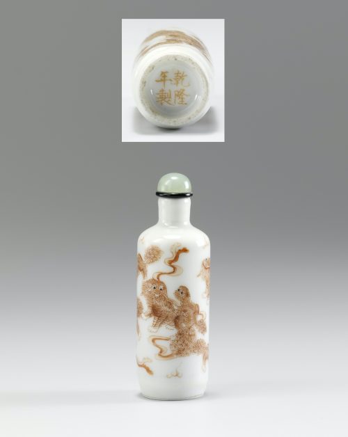 Porcelain enamelled in iron red with a group of Buddhist lions